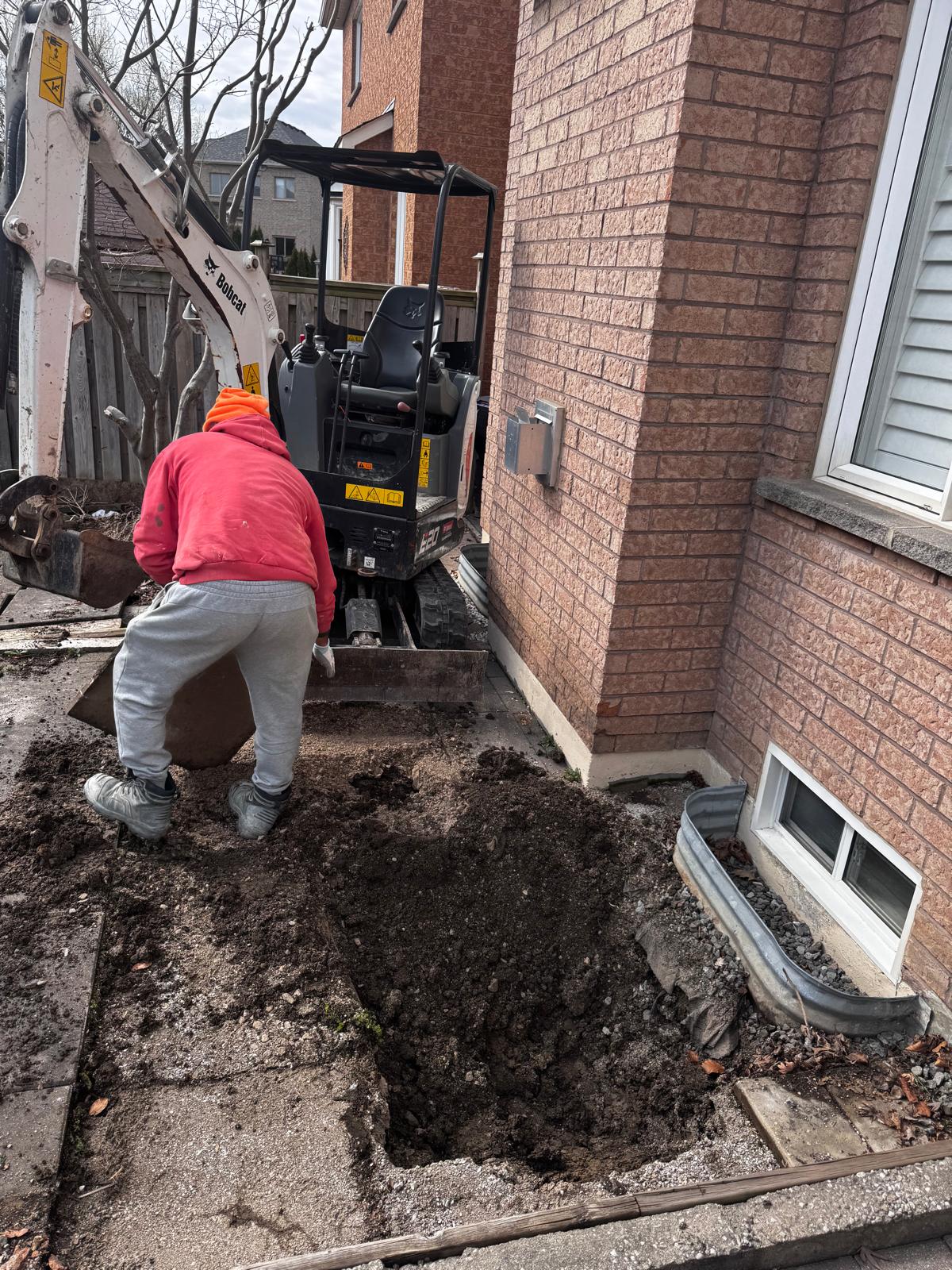 Basement window cut-out excavation work in progress