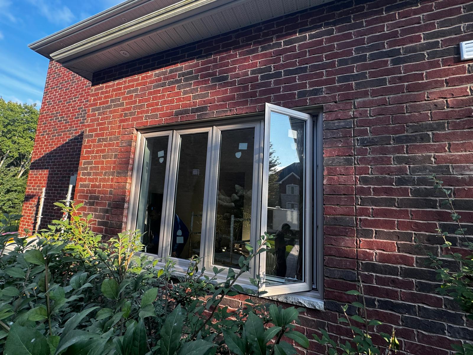 Modern casement windows with dark trim